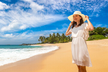 Fototapeta na wymiar Woman on a tropical beach
