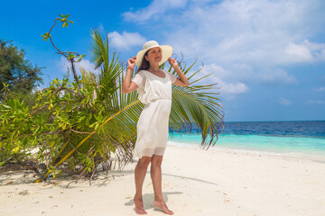 Woman standing on the beach