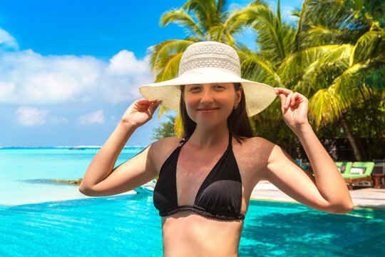 Woman at tropical swimming  pool