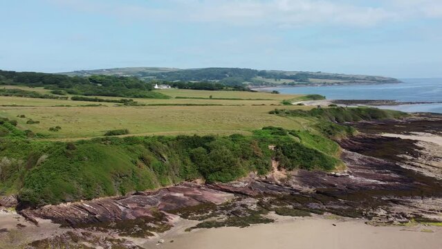 Traeth Lligwy Anglesey island eroded coastal shoreline aerial view scenic green Moelfre weathered coastline
