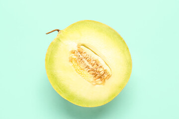 Half of sweet melon on turquoise background