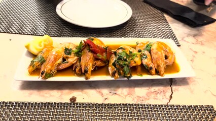 serving dish showcases succulent shrimp, perfectly sautéed with garlic, enticing the taste buds with its irresistible aroma and flavour