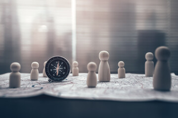 Compass and The wooden doll represents the employee of the company on route map represents networking, connection.  Corporation, Enterprise concept.
