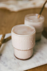 Fototapeta na wymiar Iced chocolate milkshake in a trendy ripple glasses
