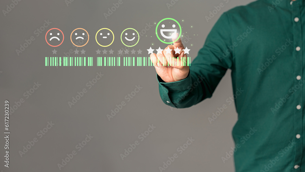 Poster customer's hand is touching virtual screen on the happy smile face icon to give satisfaction in serv