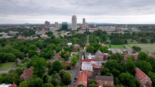 Aerial high push into Winston Salem NC, North Carolina over Old Salem
