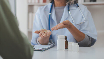 Young doctor visiting elderly woman at home