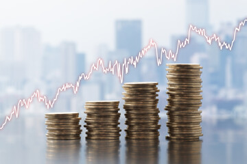 Inflation of prices and business activity. Stack of coins and graph on cityscape background.