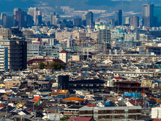 Fototapeta na wymiar 超望遠で高台から撮影した大阪の街並み