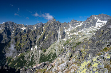 Fototapeta na wymiar An outstanding mountain landscape of the High Tatras. A view from the Lomnicka Pass to the Little Cold Valley. Mala Studena Dolina, Slovakia.