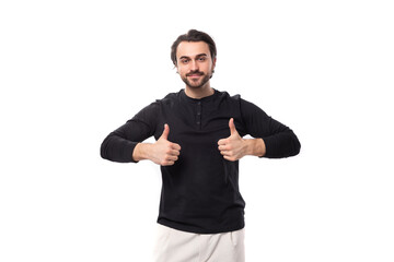 young handsome brunet european man in black sweatshirt with mockup on isolated white background