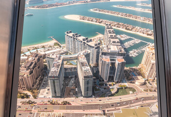 Fototapeta na wymiar View from observation deck of the Nakheel Mall building to the Palm Jumeirah island in Dubai city, United Arab Emirates