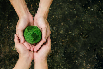 Net Zero and Carbon Neutral Concepts.Close up hands holding the earth to protect nature Save and...