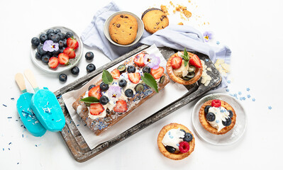 Dessert table. Top view, Summer cake with berries. Healthy dessert concept.
