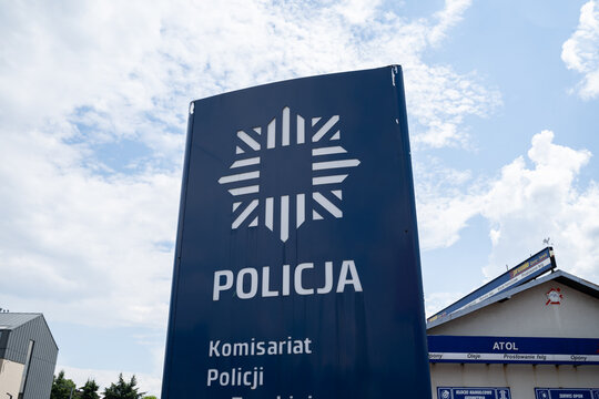 Police information sign with logo in Poland, indicating the location of a police station. Letters in Polish language, Policja means Police on June 18, 2023 in Trzebinia, Poland.
