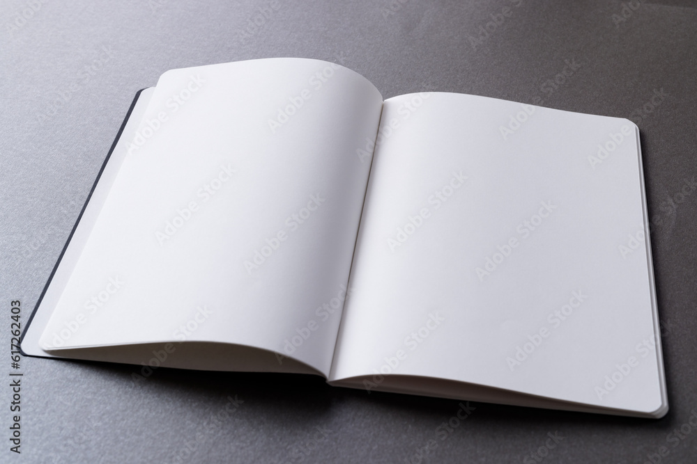 Poster close up of open book with copy space on grey background