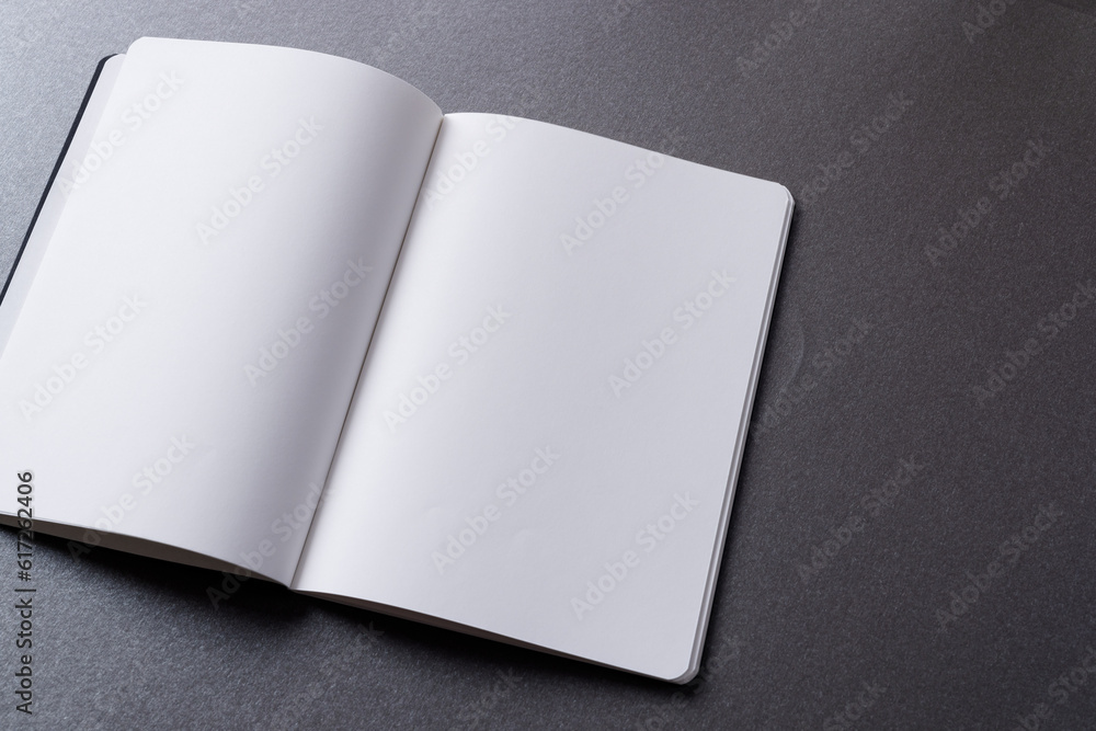 Poster close up of open book with copy space on grey background