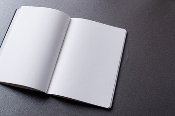 Close up of open book with copy space on grey background