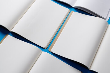 Close up of open books with copy space on blue background
