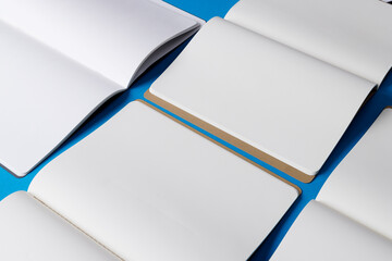 Close up of open books with copy space on blue background