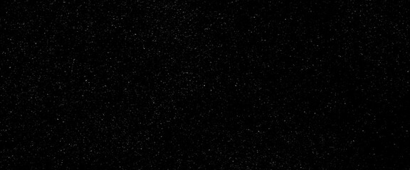 Flying dust particles on a black background, black glitter texture sparkling festive glowing shiny wrapping paper background.
