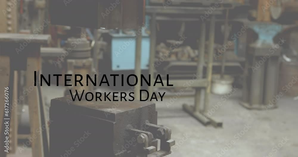Poster animation of international workers day text over machine in workshop