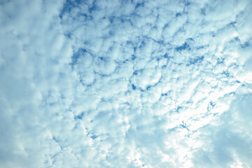 blue sky background with tiny clouds.