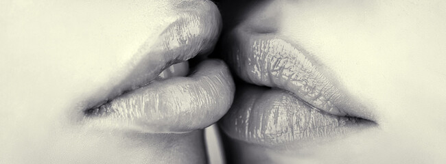 Lesbian couple kiss lips. Passion and sensual touch. Closeup of women mouths kissing. Two beautiful...