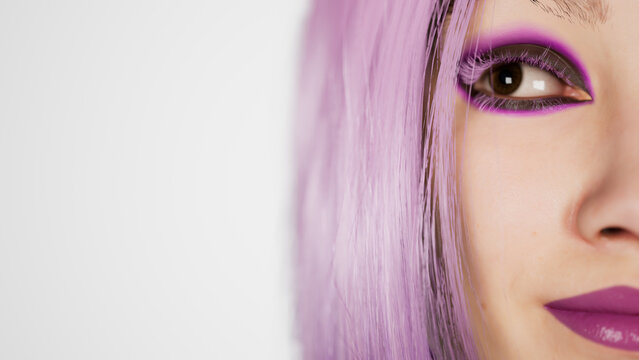 Sexy girl with glowing makeup and violet hair giving a seductive look in the studio on a white background - modern voque concept 4k footage extreme close up shot, 3d render