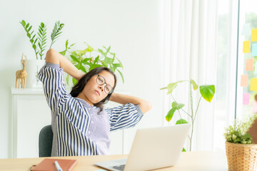 Asia woman touching massage stiff neck after sedentary computer work in incorrect posture