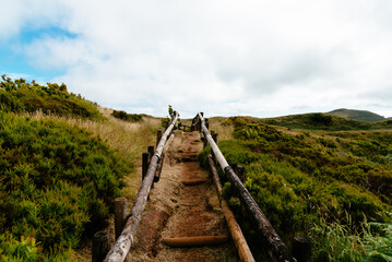 Pathway through Furnas do Enxofre a foggy day of summer. Terceira Island, Azores, Portugal