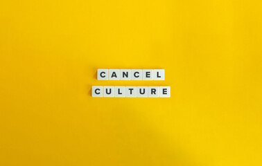 Cancel Culture Phrase on Block Letter Tiles on Yellow Background. Minimal Aesthetic.