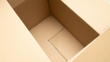 open cardboard boxes close-up, cutout for handle in cardboard box