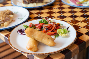 Wholesome, colorful plate of fresh fruits and vegetables - a scrumptious healthy meal.