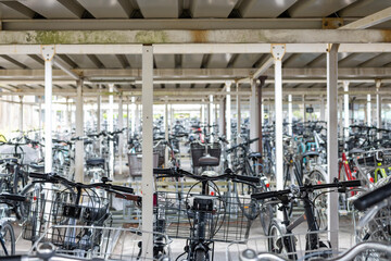 Japanese bicycle parking lot with many bicycles parked