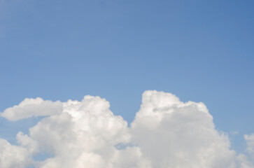 Sky and clouds in summer sunshine, with copy space.