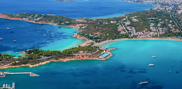 Aerial view of the famous Astir luxury retreat beach at the Vouliagmeni district of Athens, Greece, with turquoise shining sea © moofushi
