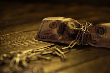 The American currency is dollars, tied with a chain. The concept of blocking payments and transfers...