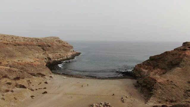 Medio Almud Beach: aerial shot with crane movement over the Medio Almud beach on the island of Gran Canaria. Mogan Municipality.