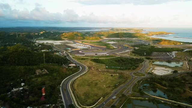 Aerial of the Pertamina Mandalika International Street Circuit track , Kuta, Lombok Island, Indonesia. Drone dolly forward shot.