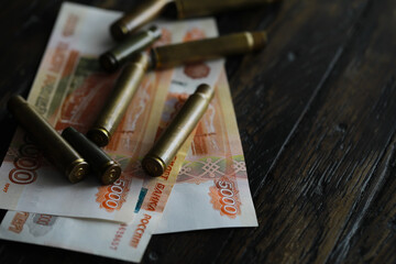 Bullets lie on the russians money money with inscription five thousands rubles top view