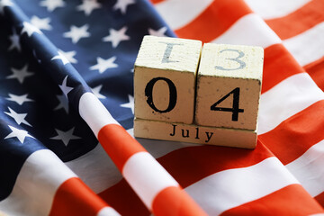 July 4th wooden Stars and Stripes flag on background with flag of the USA. Summer day. Independence Day Of America