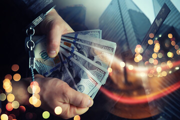  Double exposure city and hands of a man with handcuffs on a background of us dollars. Fraud, cyber...