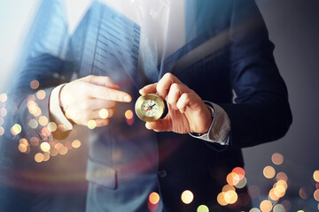 Man with black suit showing compass, double exposure, skyscraper, Concept business, finance saving...
