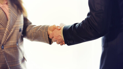 Businessman and woman shake hands as hello in office closeup. Friend welcome, introduction, greet or thanks gesture, product advertisement, partnership approval, arm, strike a bargain on deal concept