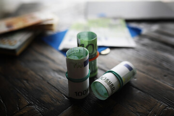 100 euro banknote pack and wood bankground. Currency, financial