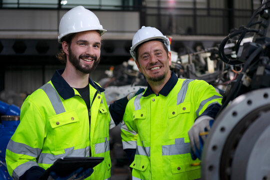 Engineer work at robotic arm factory.