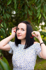 Beautiful woman eating cherry berries for fun