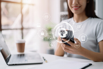 Person typing laptop computer and smartphone with SDK icon on virtual screen. SDK Software development kit programming language technology concept in office.
