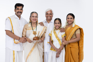 South Indian family posing in traditional clothing